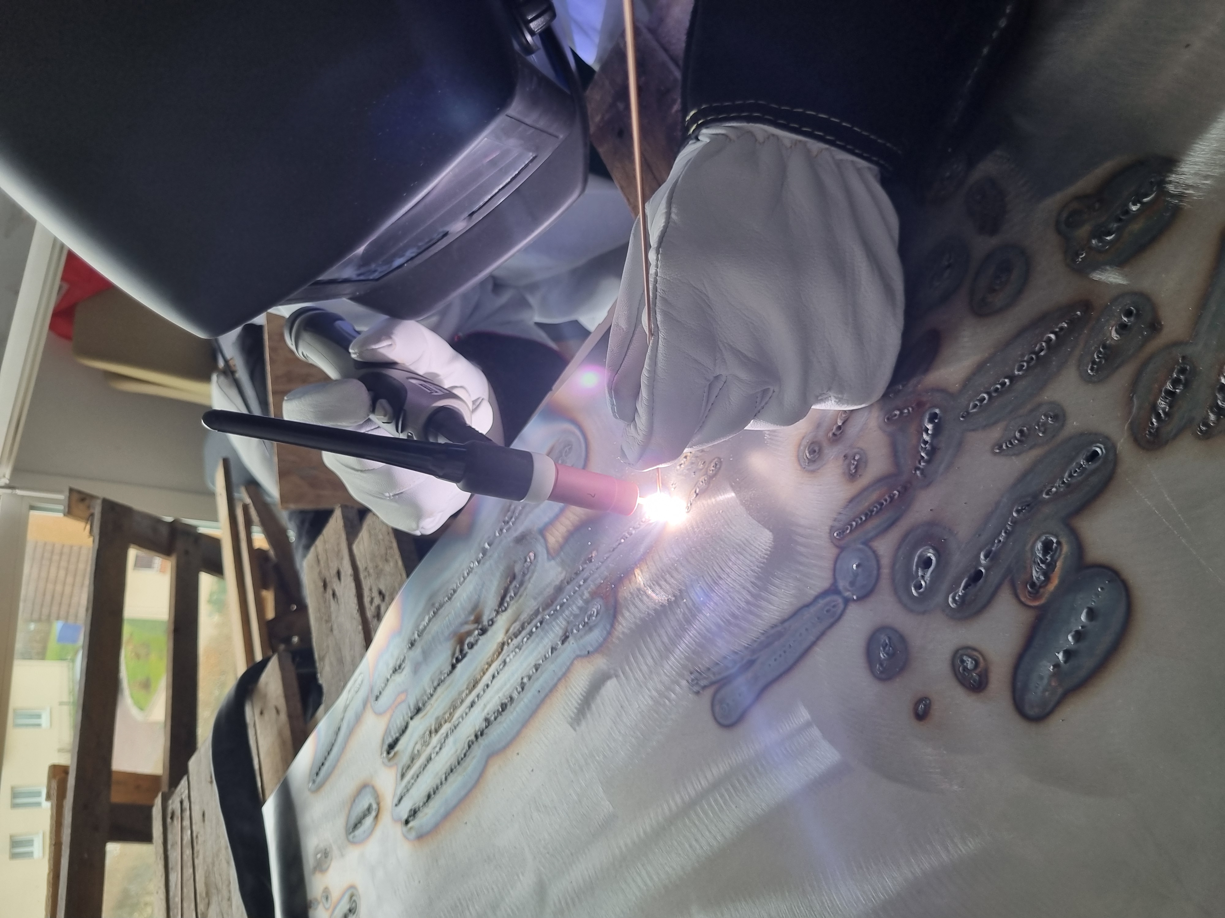 INSA Rouen Racing Team members working on the chassis